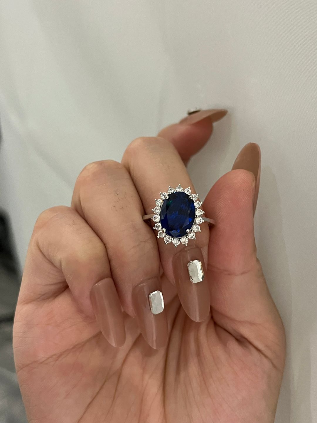 Customer photo review of 4.5 Carat Halo Oval Cut Blue/Red/Green/Yellow Sapphire Engagement Ring In Sterling Silver