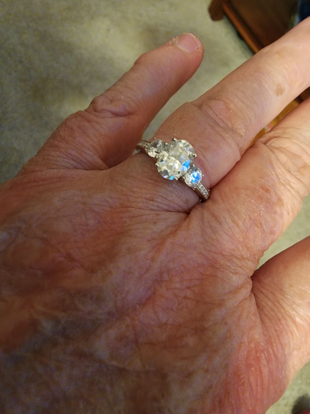 Customer photo review of Three Stone Oval Moissanite Channel-Set Engagement Ring