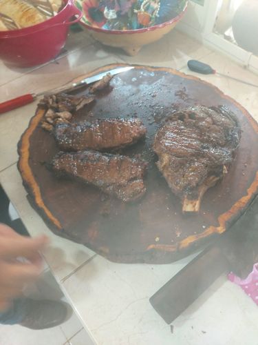 Reseña con foto de un cliente sobre New York Steak