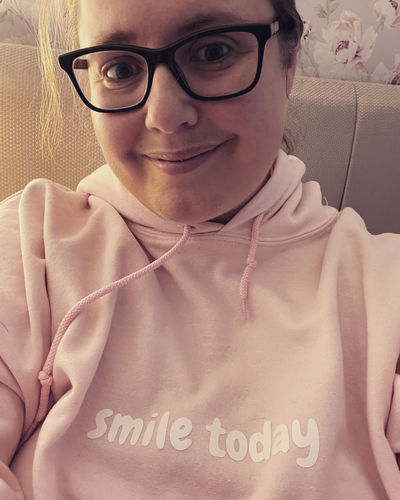 Customer photo review of Light Pink Smile Today Hoodie