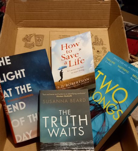 Customer photo review of Surprise Subscription Box of 4 Fiction Books