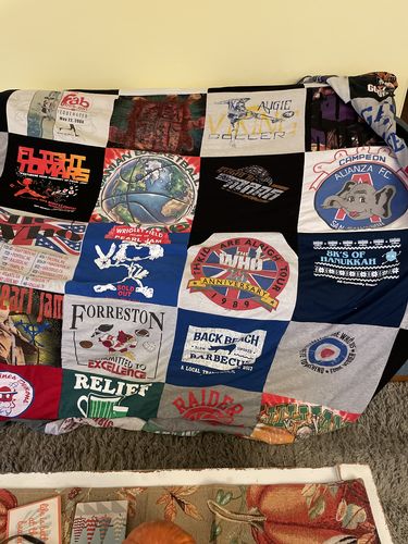 T-shirt quilt with sports, community service themes by Tom from IL