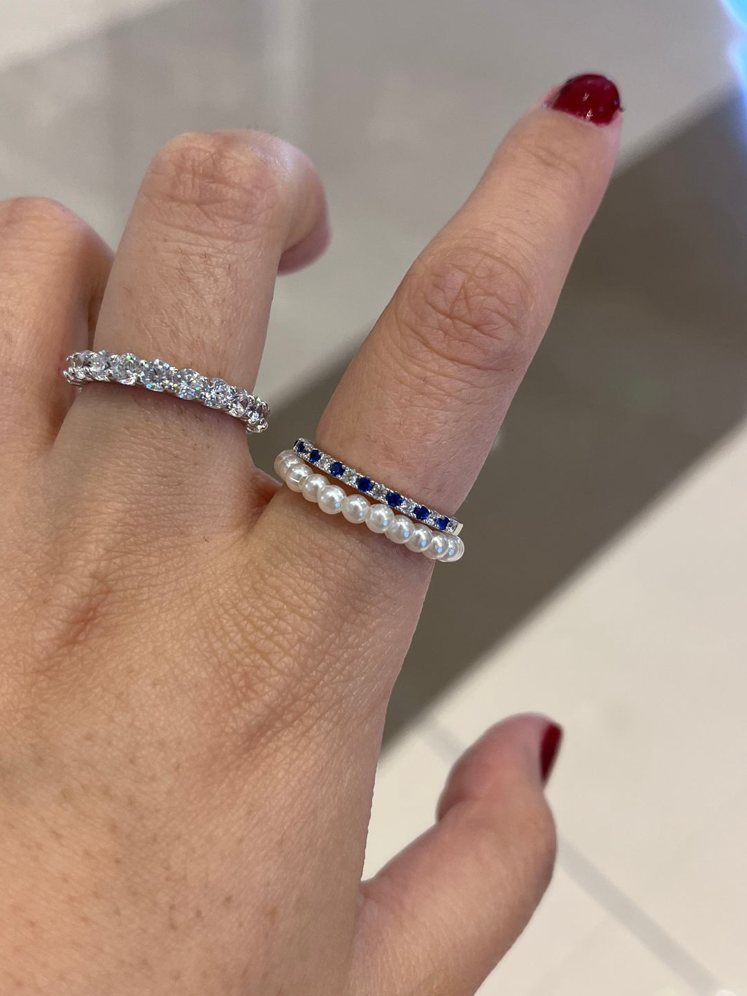 Customer photo review of Louily 0.3 CT Round Cut Half Eternity Blue And White Sapphire Wedding Band For Women In Sterling Silver