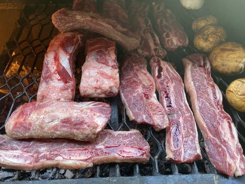 Reseña con foto de un cliente sobre Asado de Tira