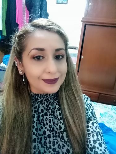 Customer photo review of Aretes mariposa pompón sin perforación