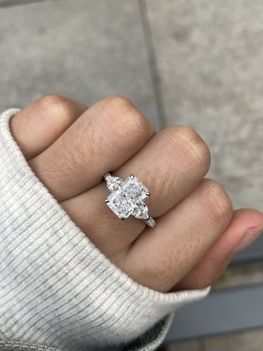 Customer photo review of Louily 5.0 Carat Radiant Cut Three Stone Engagement Ring With Two Heart Cut Side Stones