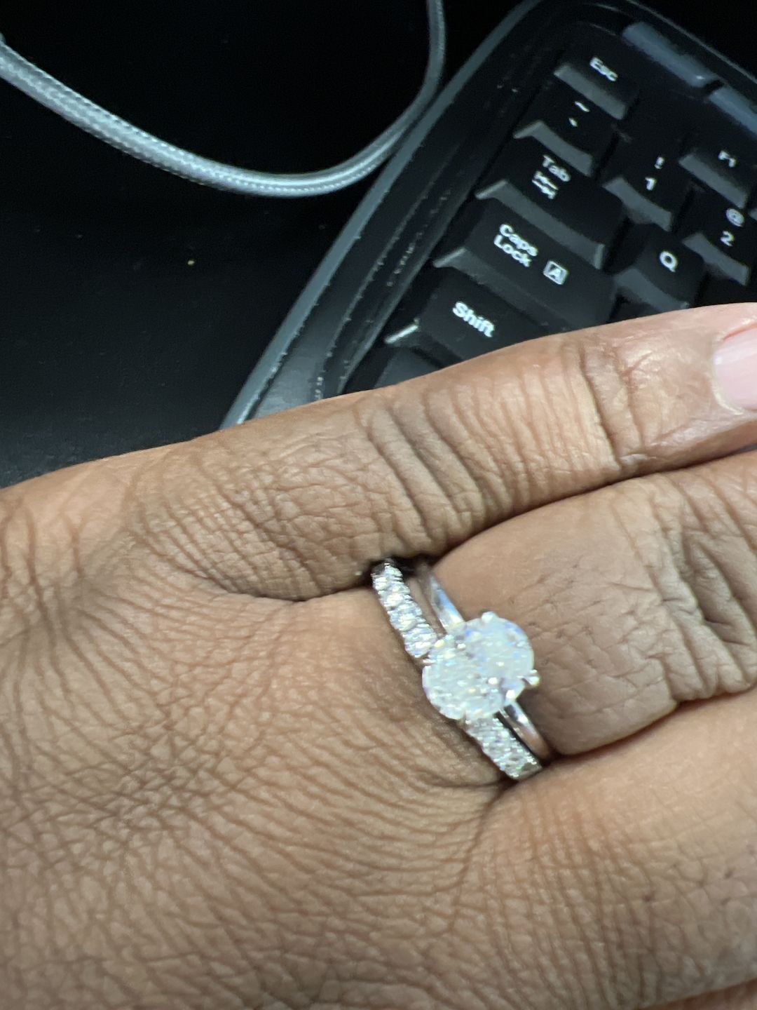 Customer photo review of Pave Moissanite Eternity Wedding Band Ring In Sterling Silver