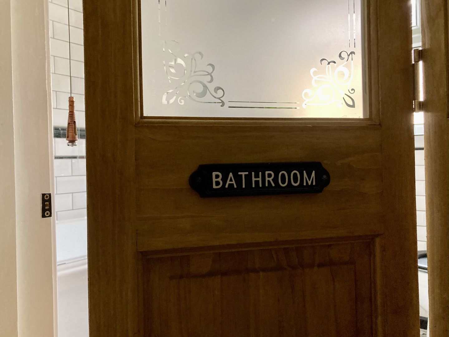 Customer photo review of Bathroom Door Sign