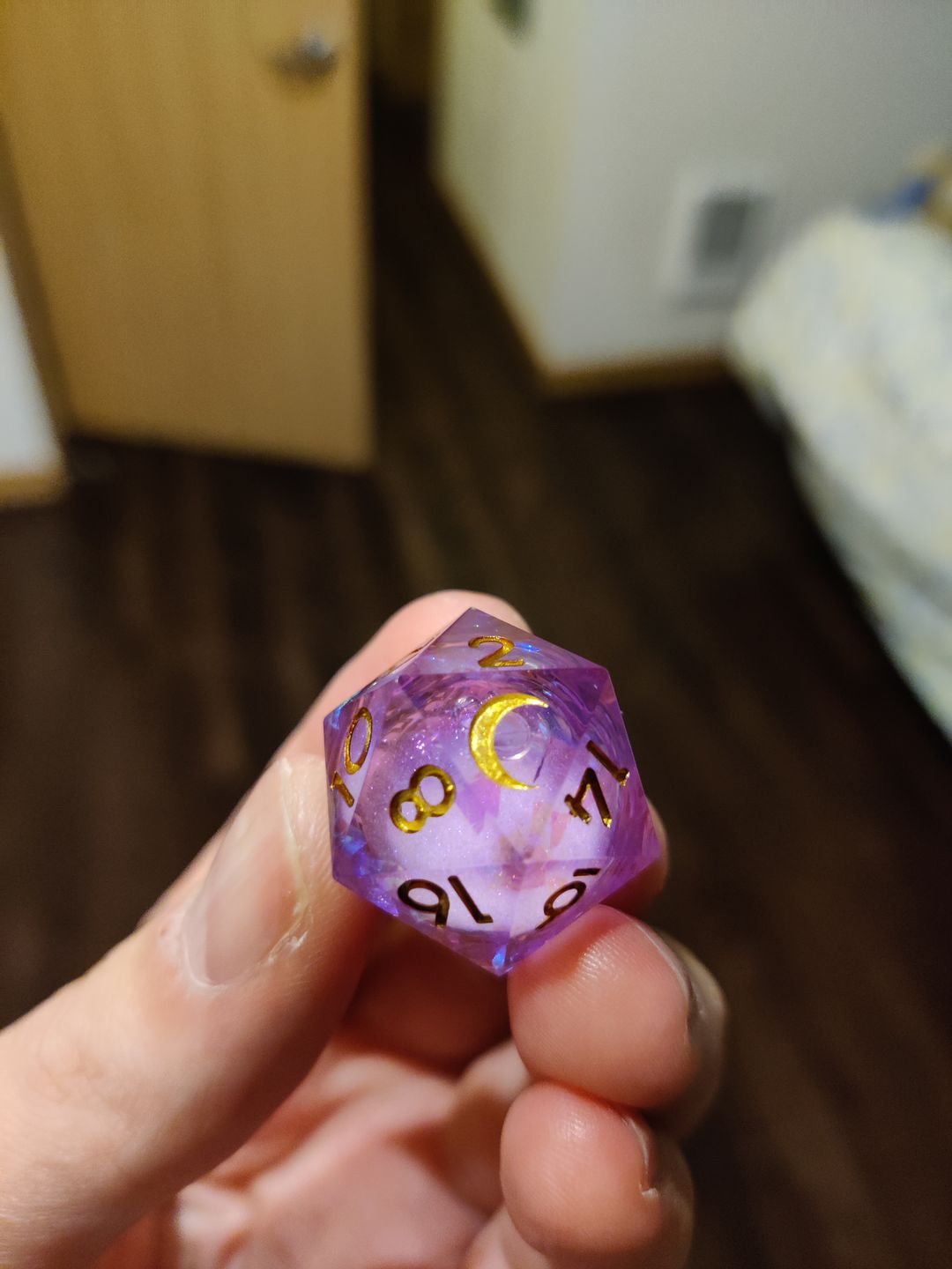 Customer photo review of URWizards D&D Purple Glitter Liquid Heart Resin Engraved Dice Set Moon