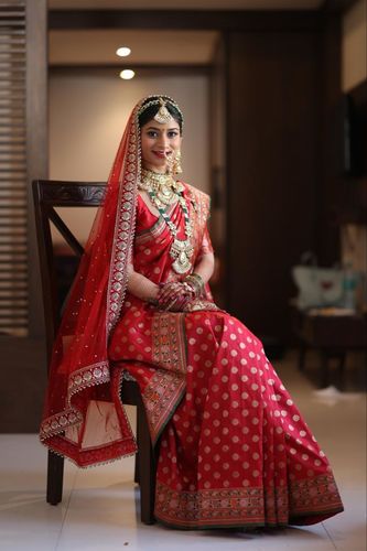 Customer photo review of SUHANI : BANARASI SILK SAREE IN THE SHADES OF RED WITH BEAUTIFUL KADWA MUGHAL BOOTAS