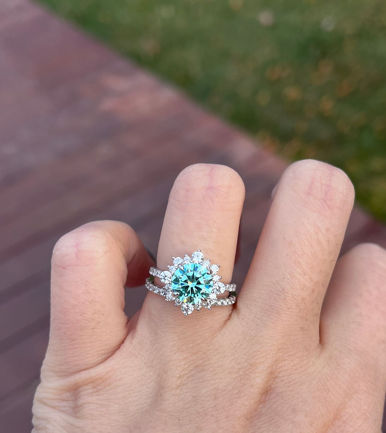 Customer photo review of S925 Moissanite 2 Ct Snowflake Design Halo Round Cyan Blue Stone Engagement Ring