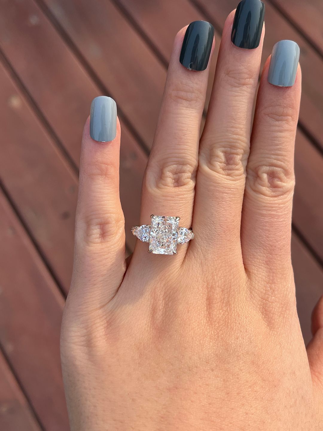 Customer photo review of Louily 5.0 Carat Radiant Cut Three Stone Engagement Ring With Two Heart Cut Side Stones