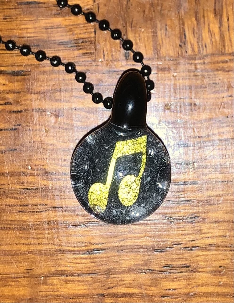 Customer photo review of Music Note Hologram Pendant with Infused Cremation Ash