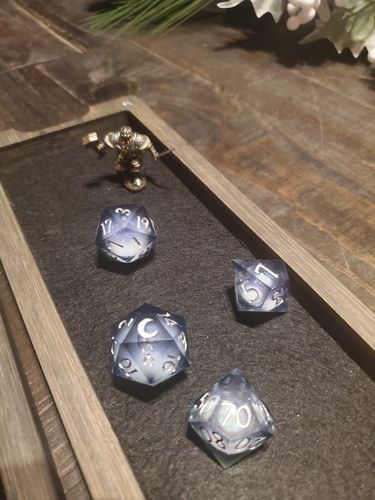 Customer photo review of Liquid Core Sharp Edge Resin DnD Dice Set Dark Blue Moon Dice