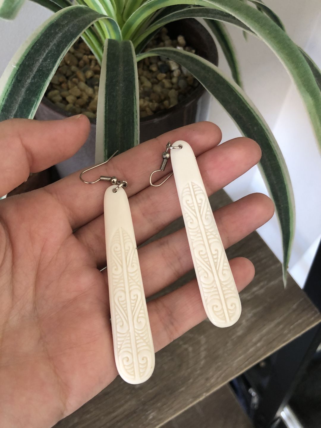 Customer photo review of Long Maori Bone Earrings with Koru Surface Carving