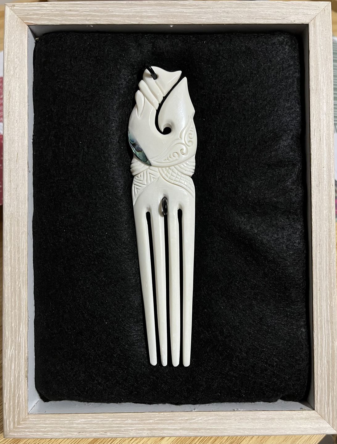 Customer photo review of Maori Bone Fish Hook Heru Comb with Paua Trim
