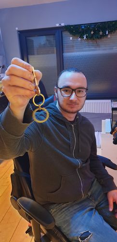 Customer photo review of Ouroboros Keychain