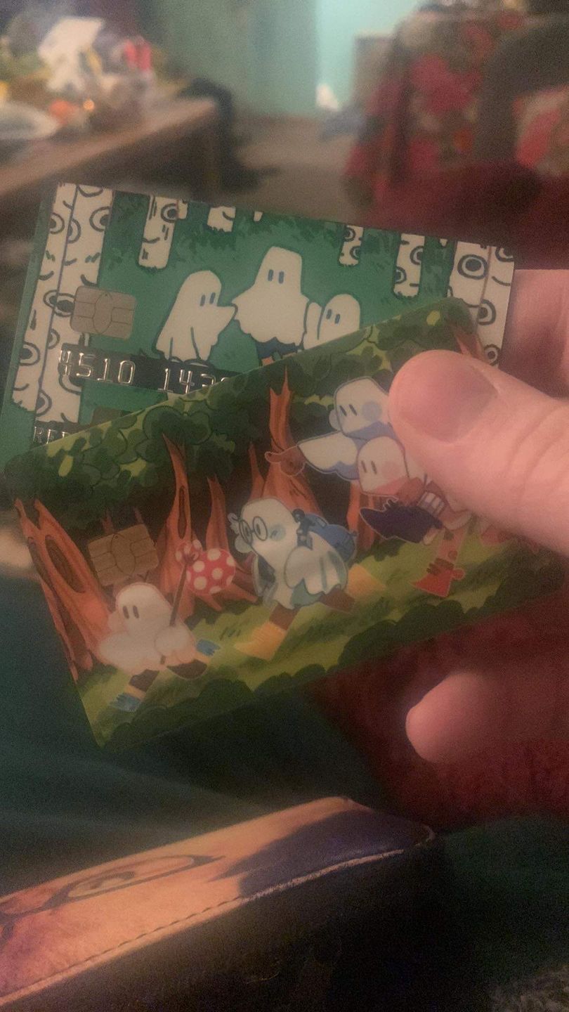 Customer photo review of Circle Ghosts Credit Card Skins