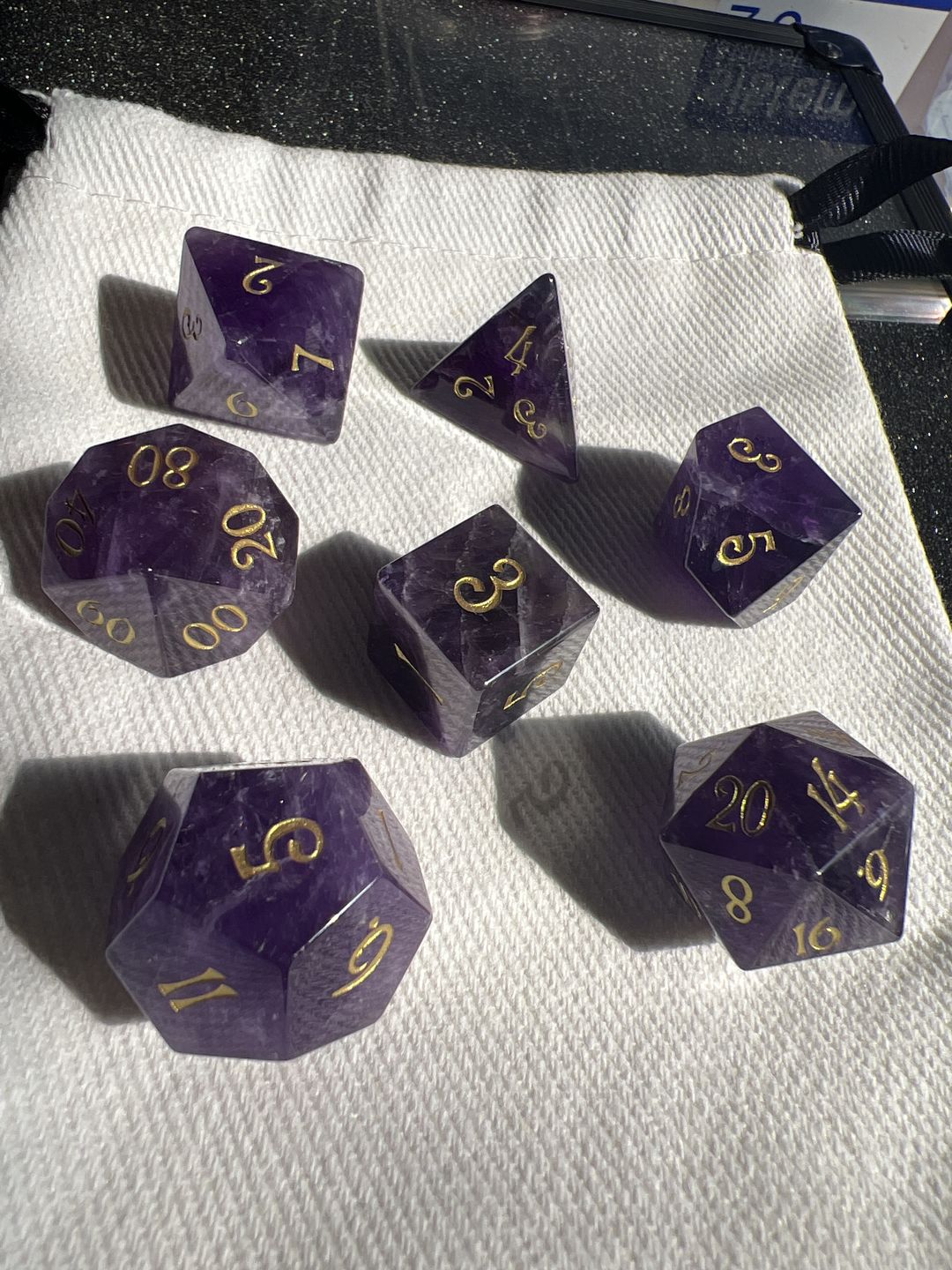 Customer photo review of URWizards D&D Amethyst Gemstone Engraved Dice Set