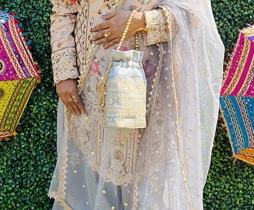 Customer photo review of Rubans Grey Colour Potli Bag With Golden Embroided And Golden Beads Design.