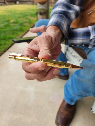 Customer photo review of .308 Real Bullet Authentic Brass Casing Refillable Twist Pen - Tactical Gift Box - Polished Brass