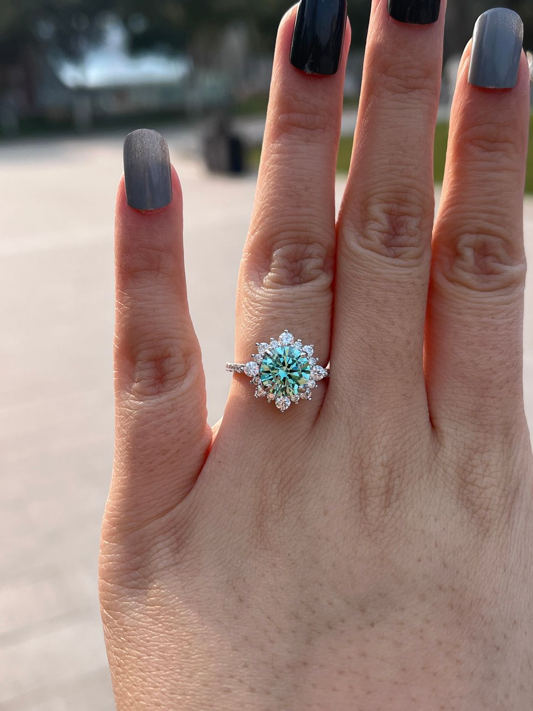 Customer photo review of S925 Moissanite 2 Ct Snowflake Design Halo Round Cyan Blue Stone Engagement Ring