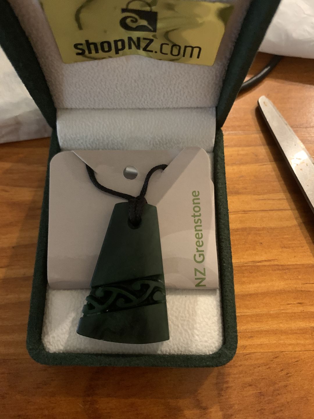 Customer photo review of Genuine NZ Greenstone Toki Necklace with Kowhaiwhai Carving