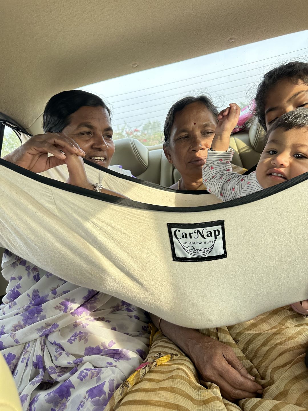 Customer photo review of CarNap - Portable Car Hammock for 0 to 2.5 year baby | with Adjustble Belt, Hammock Cloth, Hangers and Carry Bag
