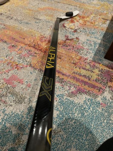 Customer photo review of Warrior Alpha DX Senior Hockey Stick (Gold)