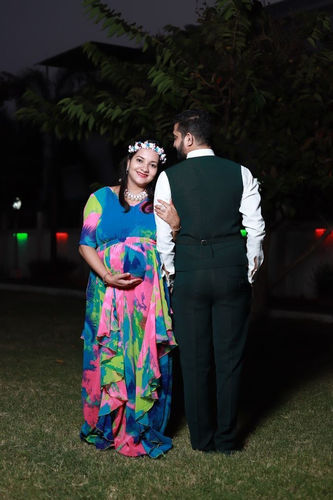 Customer photo review of Vibrant Rainbow Maternity Flow Dress