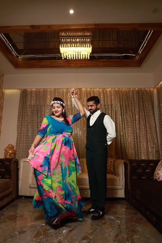 Customer photo review of Vibrant Rainbow Maternity Flow Dress