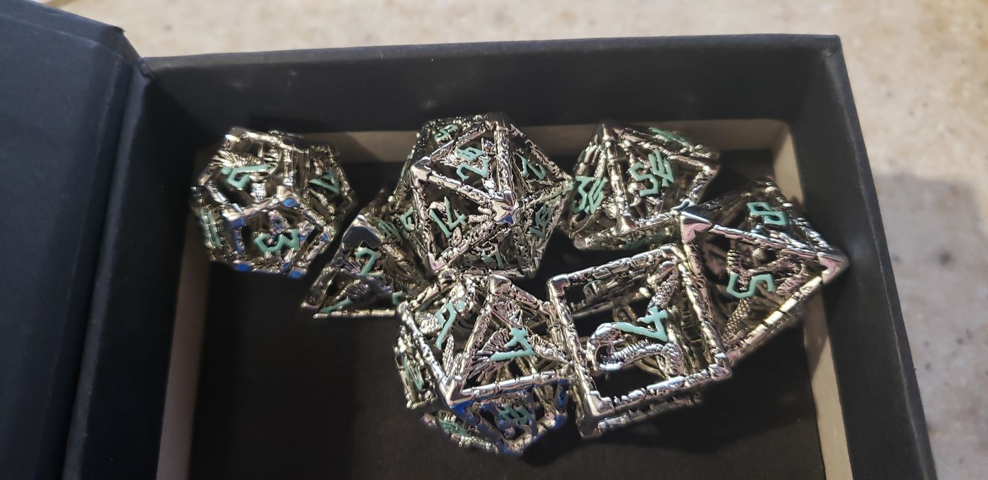 Customer photo review of LEGENDS OF VALHALLA METAL DICE - SILVER AND BLUE