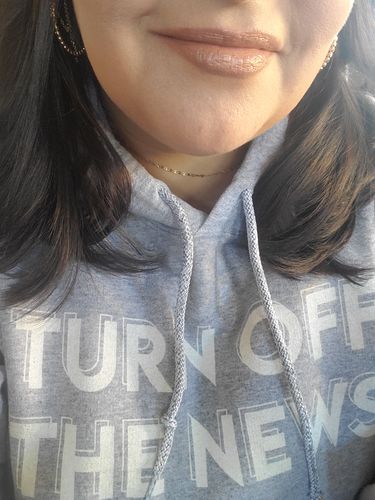 Customer photo review of Turn Off The News Hoodie