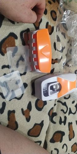 Customer photo review of Automatic Toothpaste Dispenser Wall Mount Dust-Proof Wall Mount Toothbrush Holder Squeezer