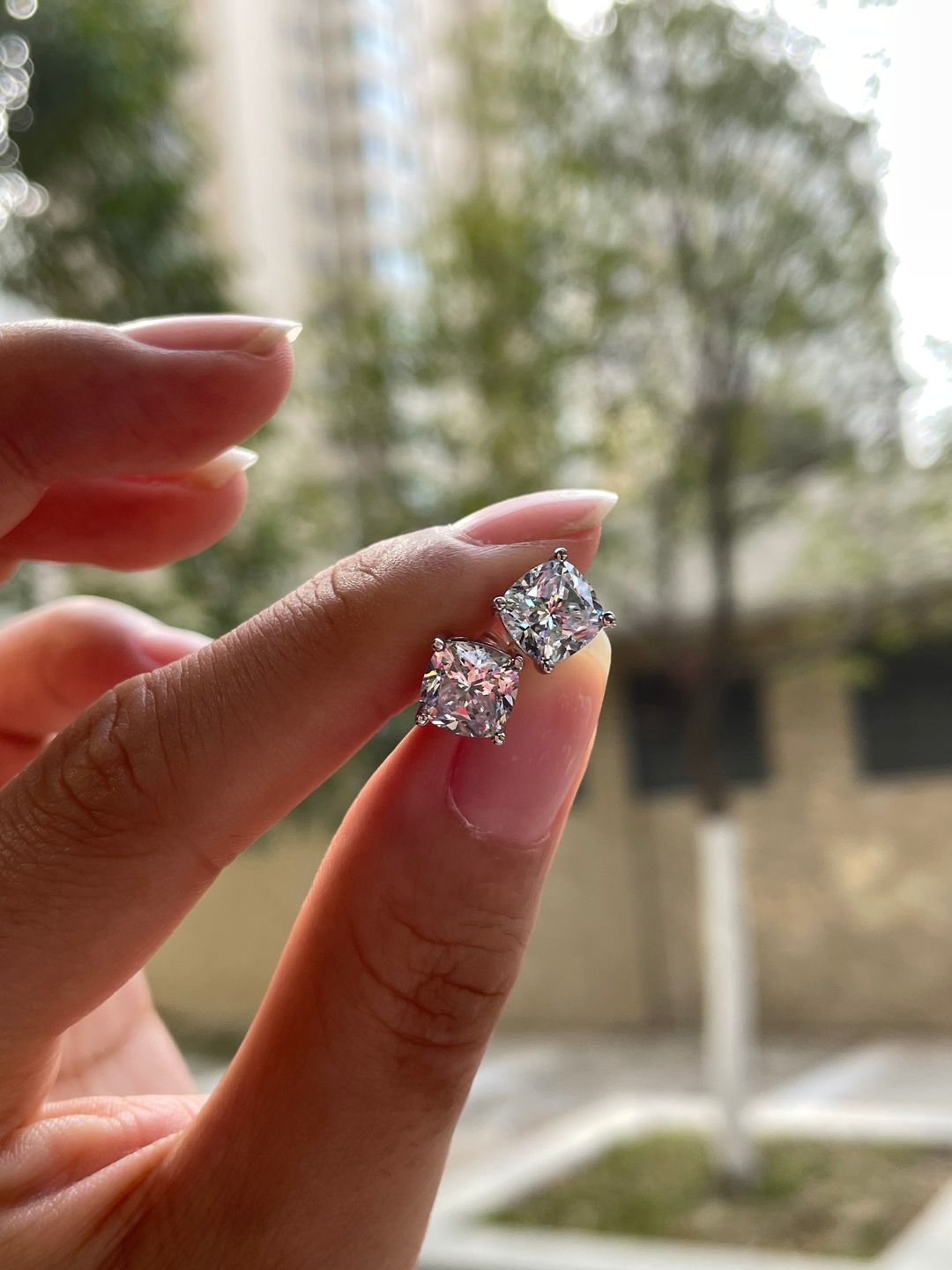 Customer photo review of Louily 1.5 CT Cushion Cut Sterling Silver Women's Stud Earrings