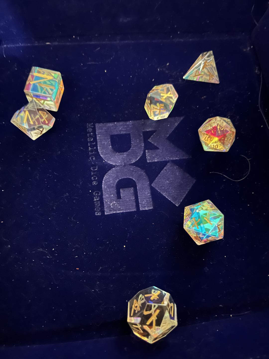 Customer photo review of URWizards D&D Dichroic Prism Glass Gemstone Engraved Dice Set Runes Numbers