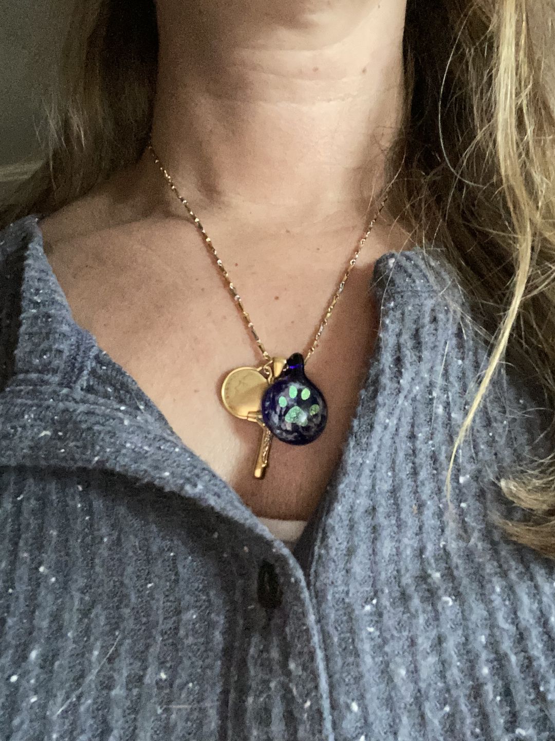 Customer photo review of Pawprint Foil Pendant with Cremation Ash