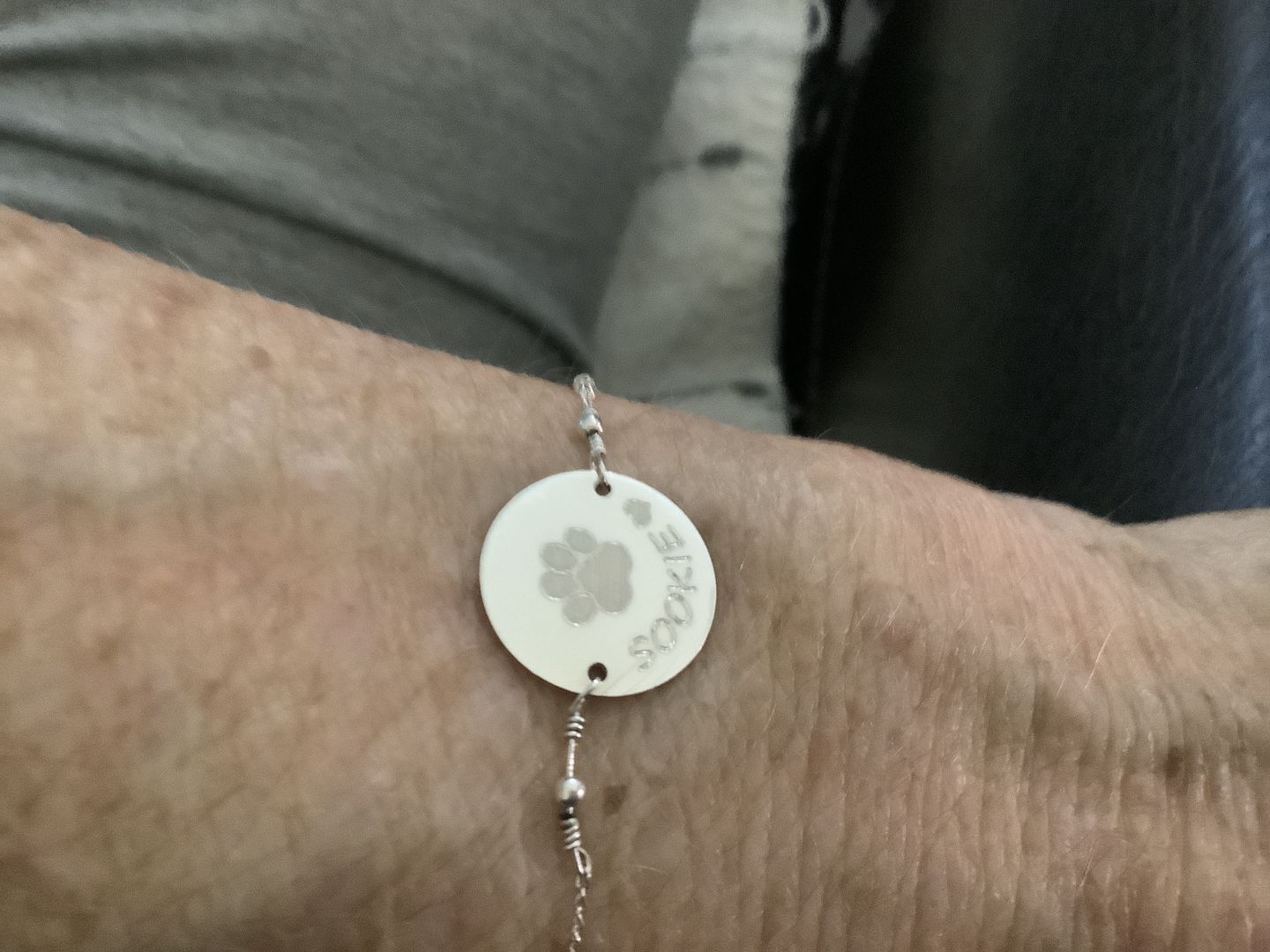 Customer photo review of Personalized Pet Bracelet with Paw Print and Name
