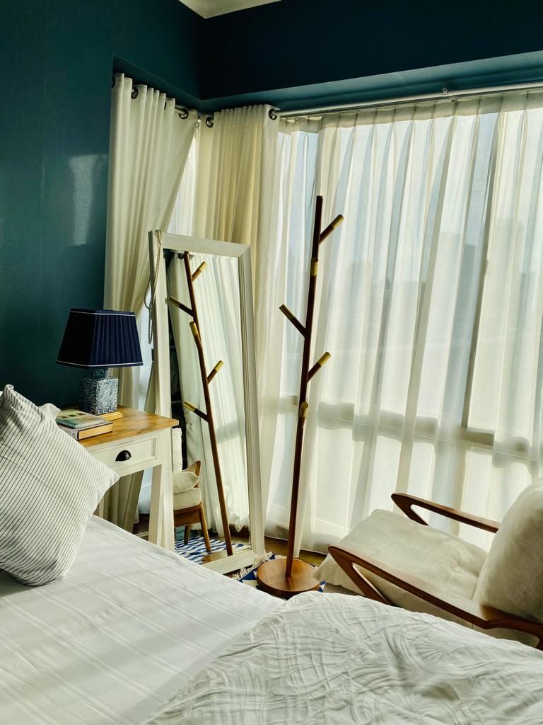 Customer photo review of Minimalist Teak Coat Rack – Branch Design