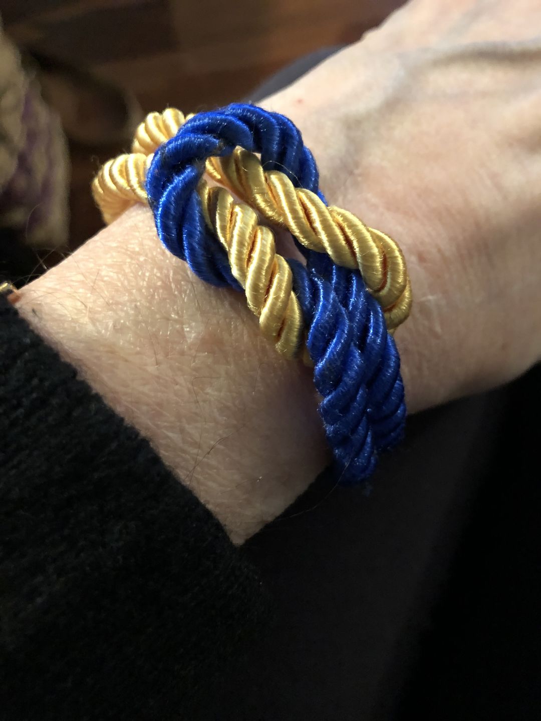 Customer photo review of The Original Love Knot Satin Rope Bracelet- Blue and Gold