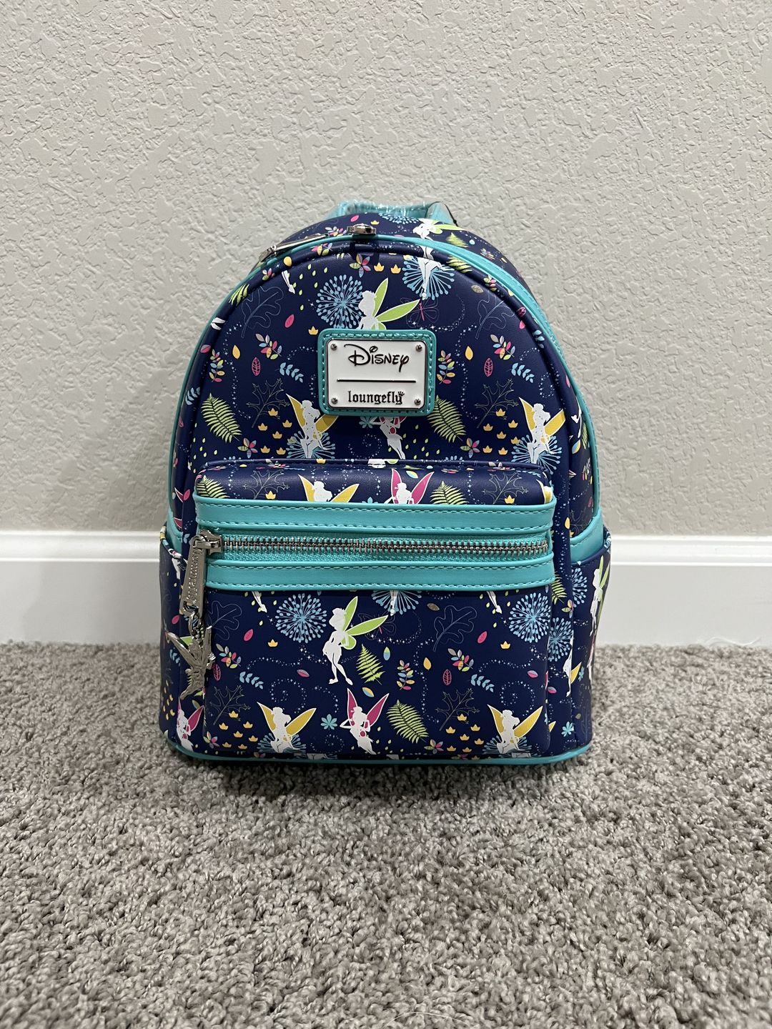 Customer photo review of 707 Street Exclusive - Disney Tinkerbell Glow in the Dark Allover Print Mini Backpack w/ Teal Straps