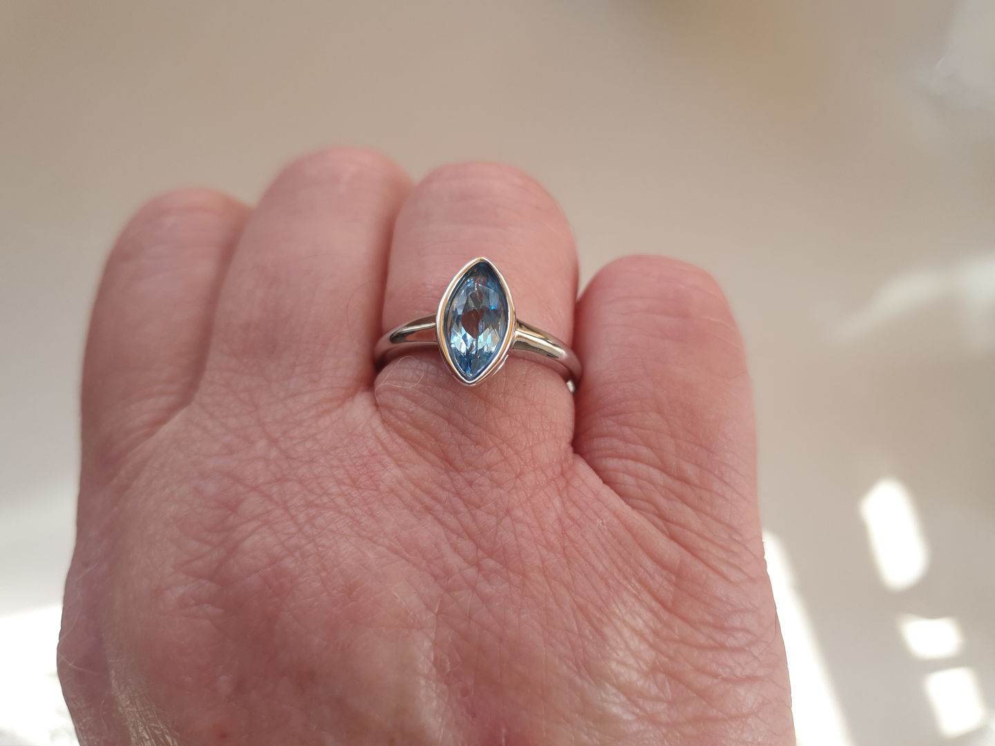 Customer photo review of Surf Moon Ring with Swiss Blue Topaz