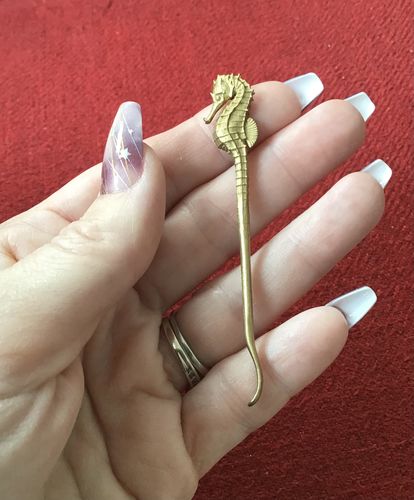 Customer photo review of HIPPOCAMPAL EAR PICK | Brass