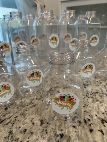 Customer photo review of 8 Oz. Clear PET Juice Bottles/Containers with Black Cap,Case of 160