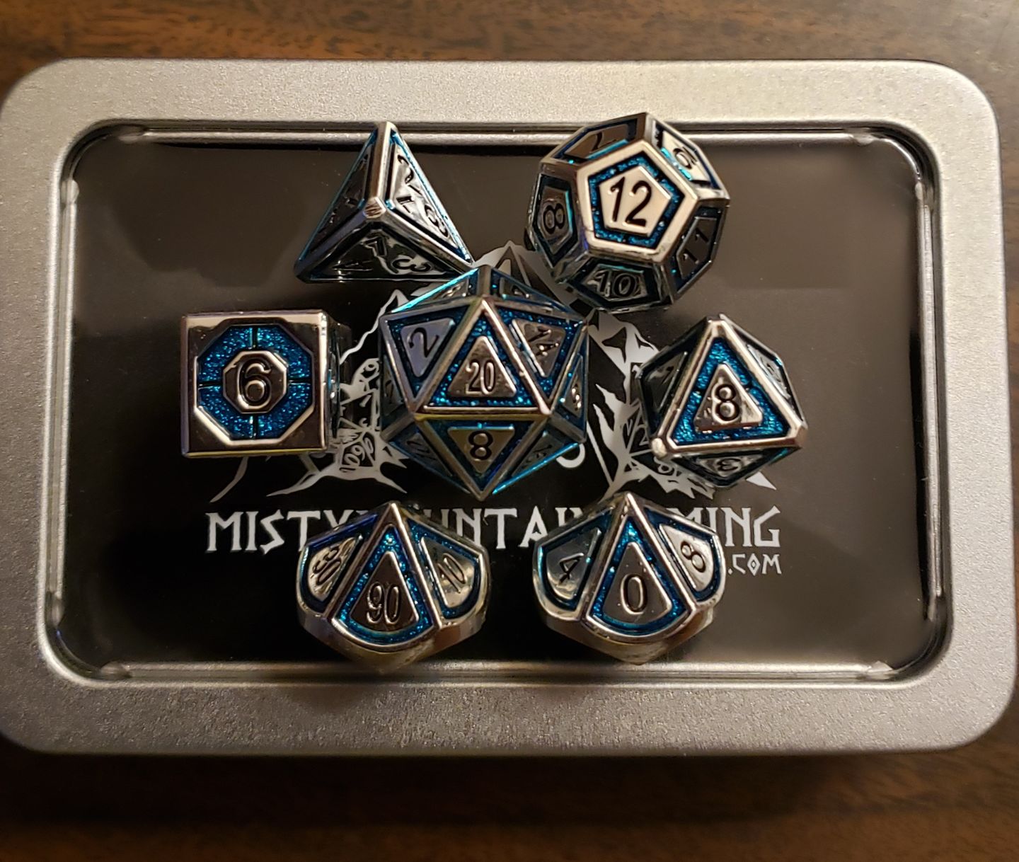 Customer photo review of CLERIC'S DOMAIN AQUA AND SILVER METAL DICE SET