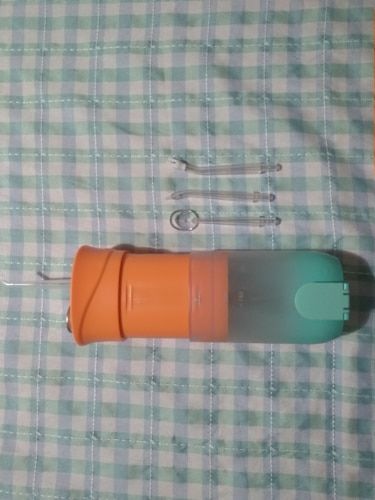 Customer photo review of HexoTeeth™ Portable Teeth Water Flosser