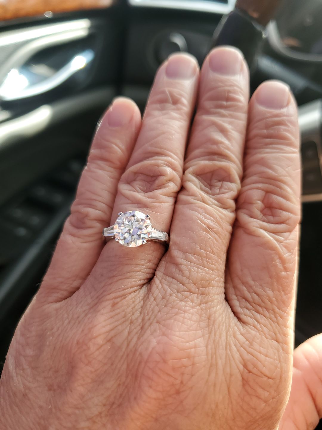 Customer photo review of Three Stone Round Moissanite Tapered Baguette Engagement Ring