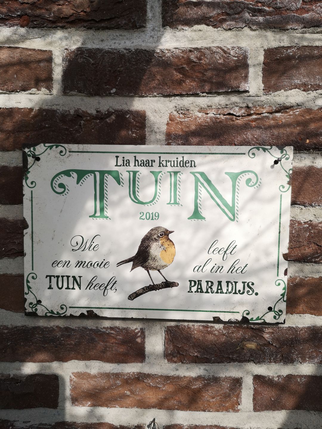 Customer photo review of Tuingeluk - Tuin-deurbord