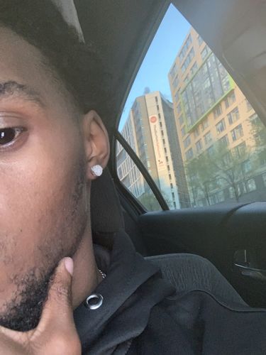 Customer photo review of 0.66 CTW Large Round VVS1 Moissanite Earrings