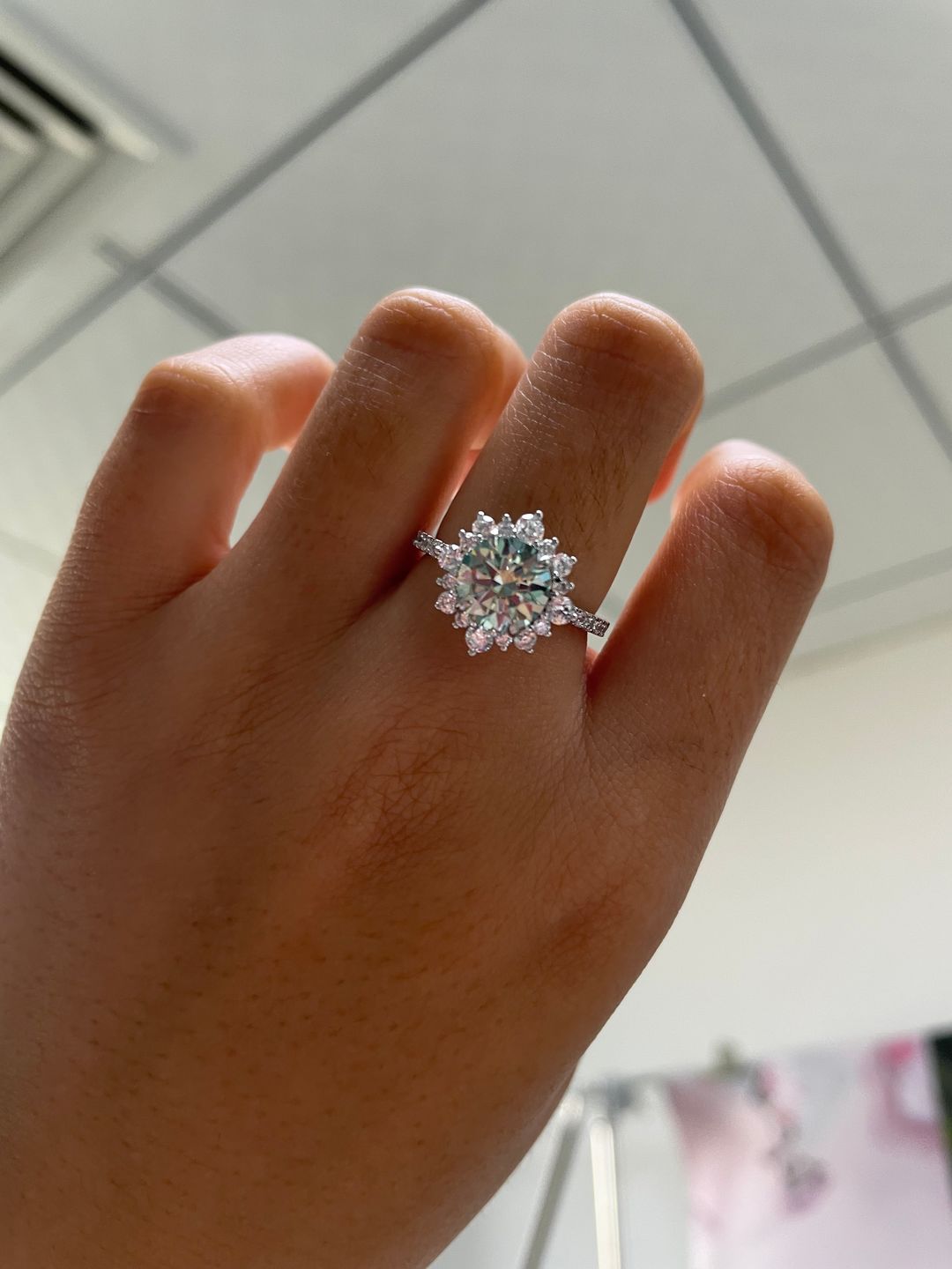 Customer photo review of S925 Moissanite 2 Ct Snowflake Design Halo Round Cyan Blue Stone Engagement Ring